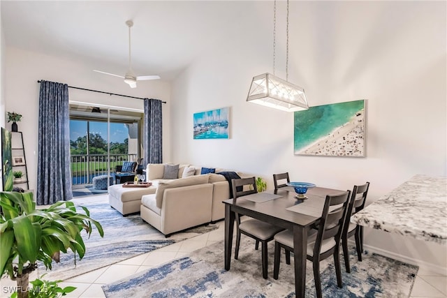 dining area featuring ceiling fan and light tile patterned floors