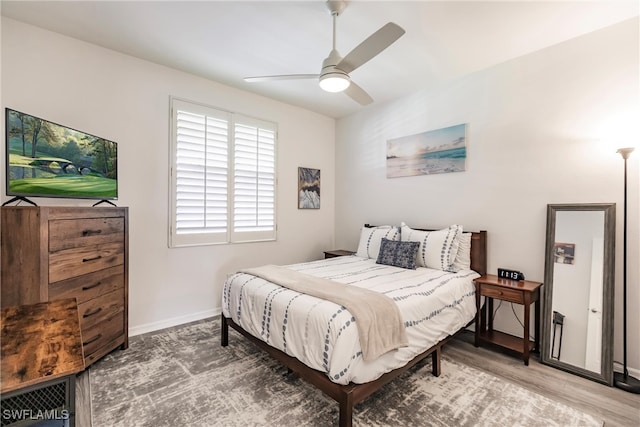 bedroom with hardwood / wood-style floors and ceiling fan