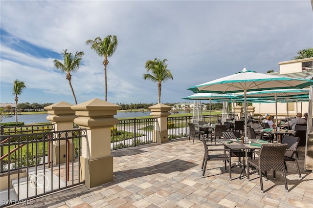 view of patio featuring a water view