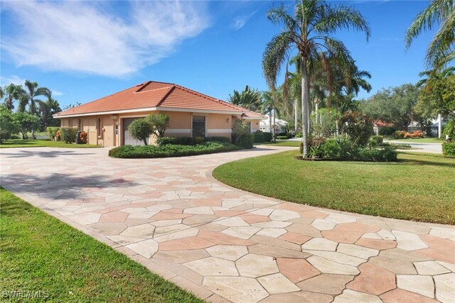4632 Shearwater Ln, Naples, FL 34119 - surrounding community featuring curved driveway and a lawn