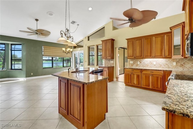 4632 Shearwater Ln, Naples, FL 34119 - kitchen with a ceiling fan, brown cabinets, stainless steel appliances, and high vaulted ceiling