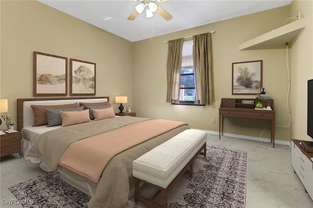 bedroom featuring light carpet and ceiling fan