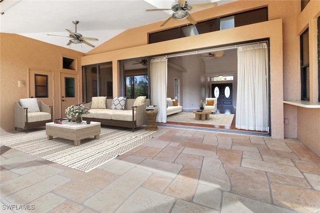 view of patio / terrace featuring ceiling fan and an outdoor living space