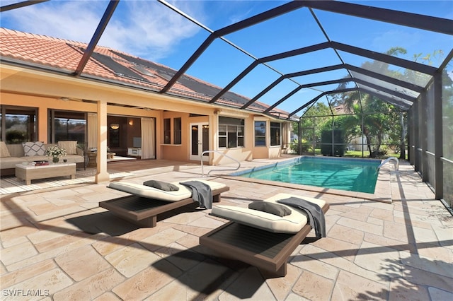 view of swimming pool with a patio and glass enclosure