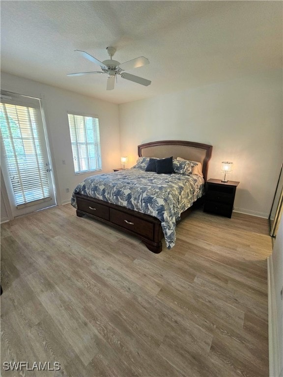 bedroom featuring light hardwood / wood-style flooring and ceiling fan