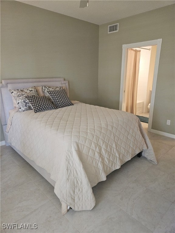 bedroom featuring ensuite bathroom and ceiling fan