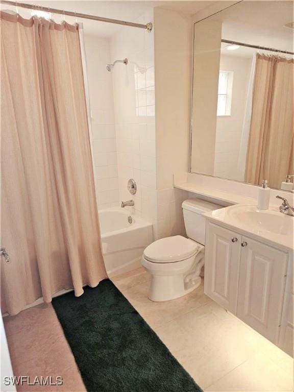 full bathroom with tile patterned flooring, shower / bath combo, toilet, and vanity