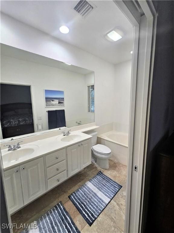 full bathroom featuring double vanity, toilet, visible vents, and a sink