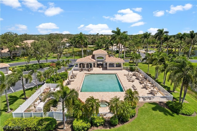 view of pool featuring a jacuzzi and a patio