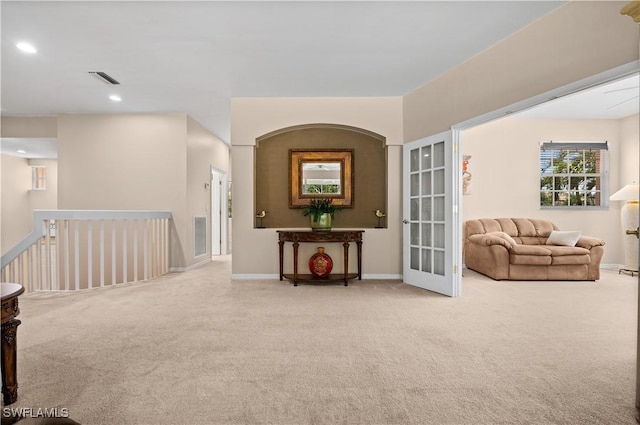 sitting room with light colored carpet