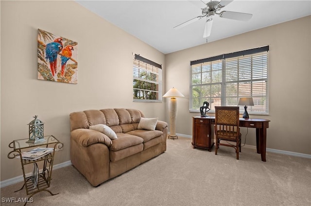 office area featuring ceiling fan and light carpet