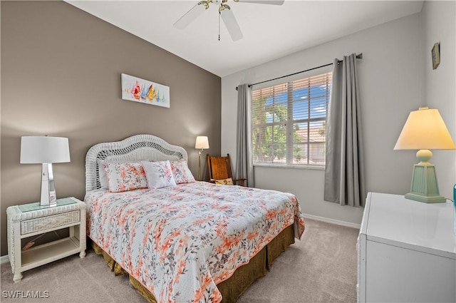 bedroom with ceiling fan and light colored carpet