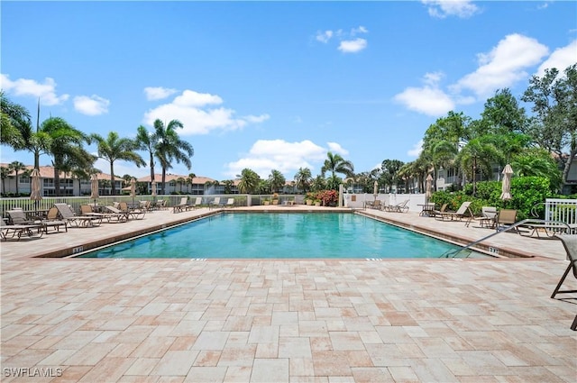 view of swimming pool with a patio