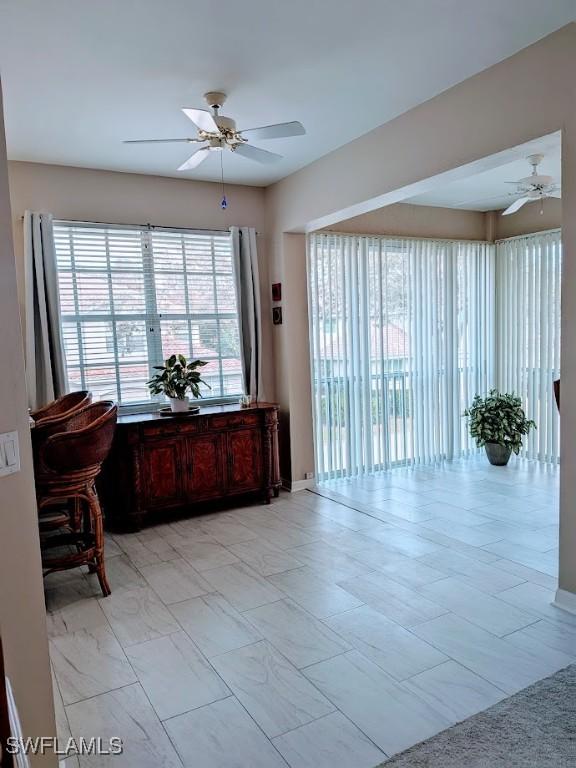 interior space featuring ceiling fan