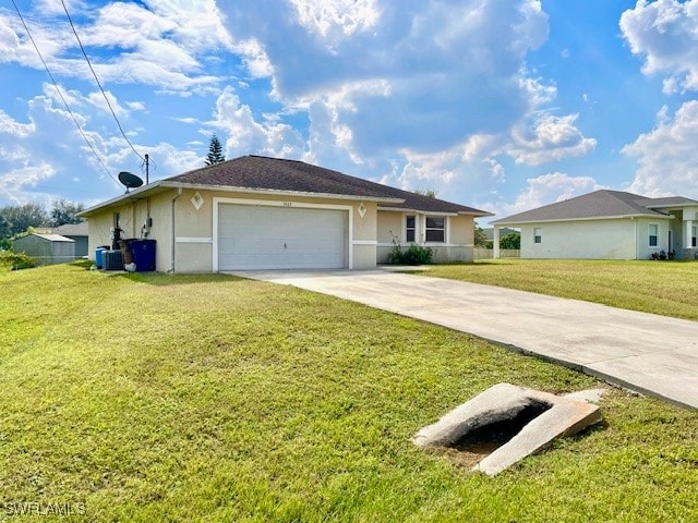 ranch-style house with a garage and a front lawn