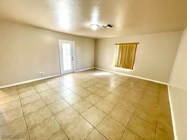 spare room with light tile patterned floors