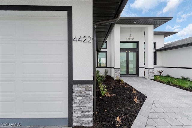 entrance to property featuring a garage