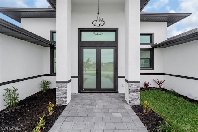 property entrance featuring french doors