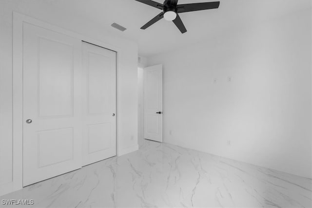 unfurnished bedroom featuring a closet and ceiling fan