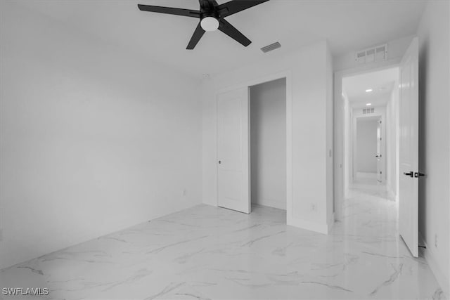 unfurnished bedroom featuring ceiling fan