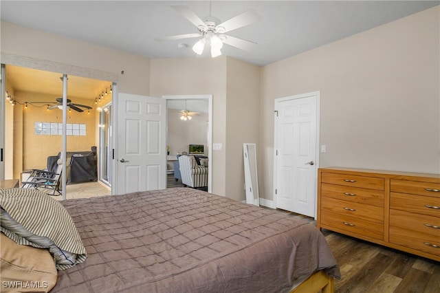 bedroom featuring access to exterior, dark wood-type flooring, and ceiling fan