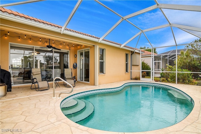 view of pool featuring a patio area, a lanai, and ceiling fan