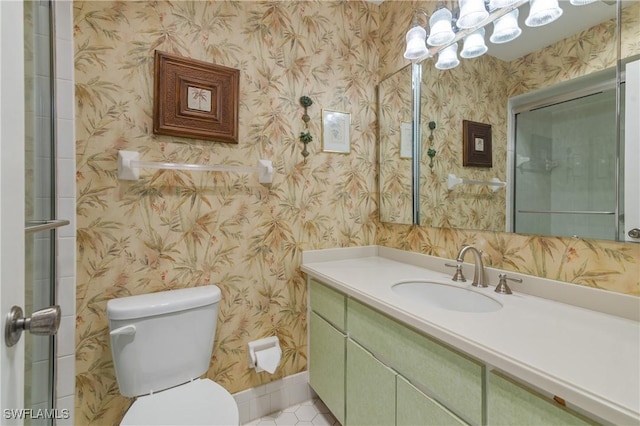 full bath featuring toilet, wallpapered walls, and vanity