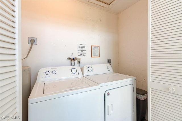 laundry area featuring washer and dryer and laundry area