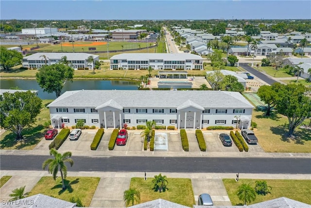 bird's eye view with a residential view and a water view