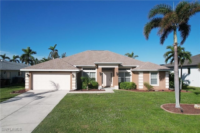 single story home with a garage and a front lawn