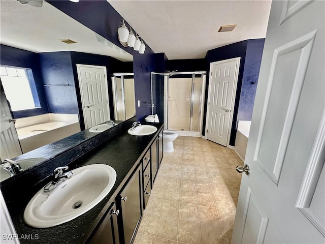 full bathroom with tile patterned floors, vanity, toilet, and independent shower and bath