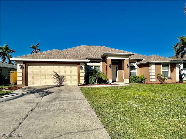 view of front of home featuring a garage and a front yard