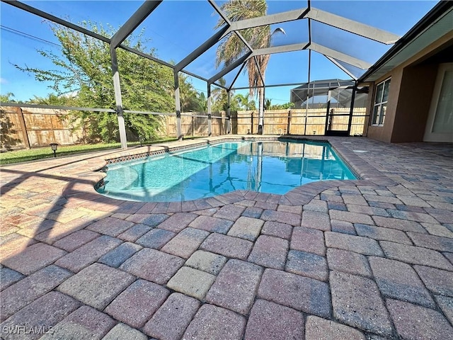 view of pool featuring a lanai and a patio area