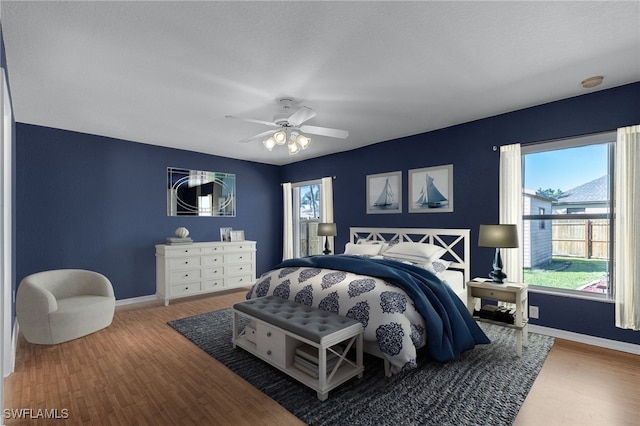 bedroom featuring hardwood / wood-style flooring and ceiling fan