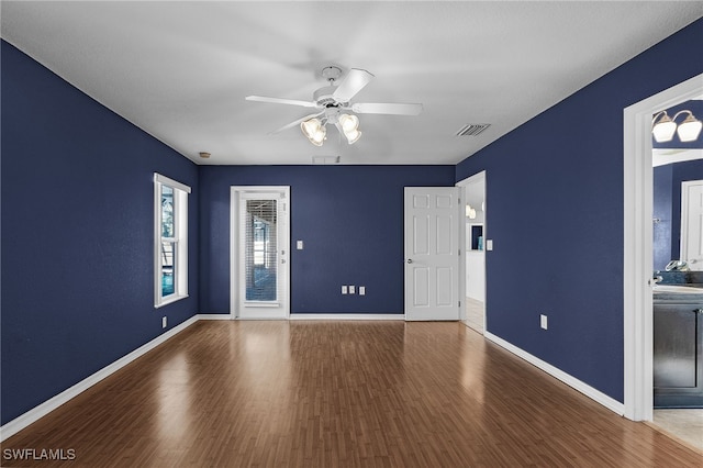 spare room featuring hardwood / wood-style floors and ceiling fan