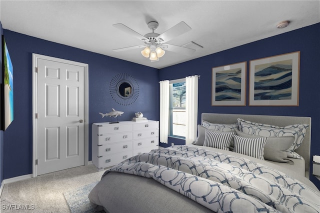 carpeted bedroom with ceiling fan