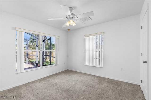 unfurnished room featuring carpet floors and ceiling fan