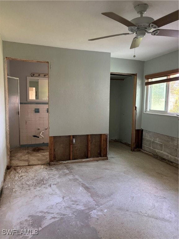 unfurnished bedroom featuring a closet and ceiling fan