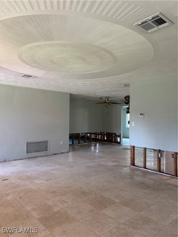 unfurnished room featuring ceiling fan