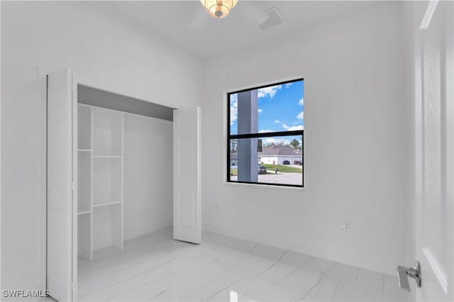 unfurnished bedroom with ceiling fan