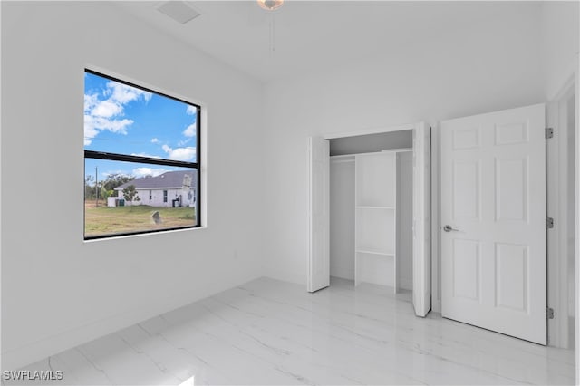 unfurnished bedroom featuring a closet