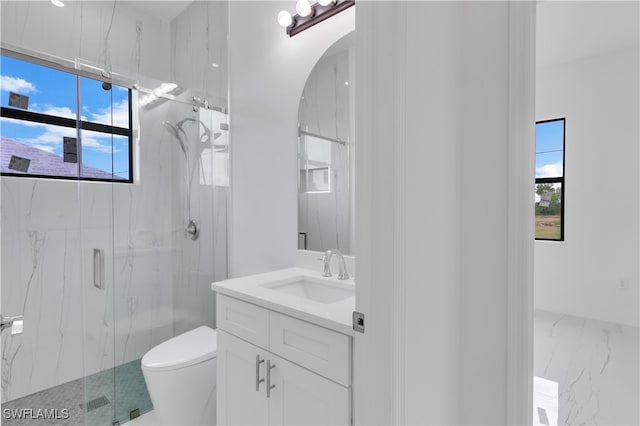 bathroom with toilet, walk in shower, a healthy amount of sunlight, and vanity