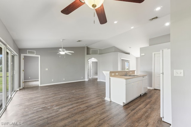 kitchen with white cabinetry, lofted ceiling, and dark hardwood / wood-style floors