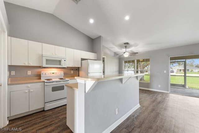 kitchen with a kitchen island, white cabinetry, vaulted ceiling, dark wood-type flooring, and white appliances