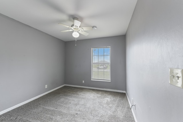 carpeted empty room with ceiling fan