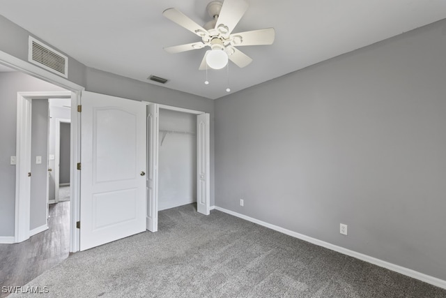 unfurnished bedroom with carpet floors, a closet, and ceiling fan