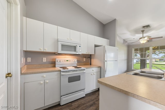 kitchen featuring dark hardwood / wood-style flooring, white cabinetry, vaulted ceiling, sink, and white appliances