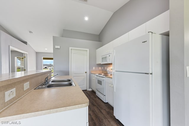 kitchen with white appliances, sink, dark hardwood / wood-style flooring, lofted ceiling, and white cabinets