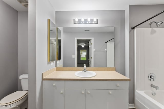 full bathroom with vanity, toilet, and  shower combination