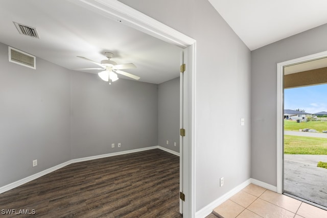 empty room featuring hardwood / wood-style flooring and ceiling fan